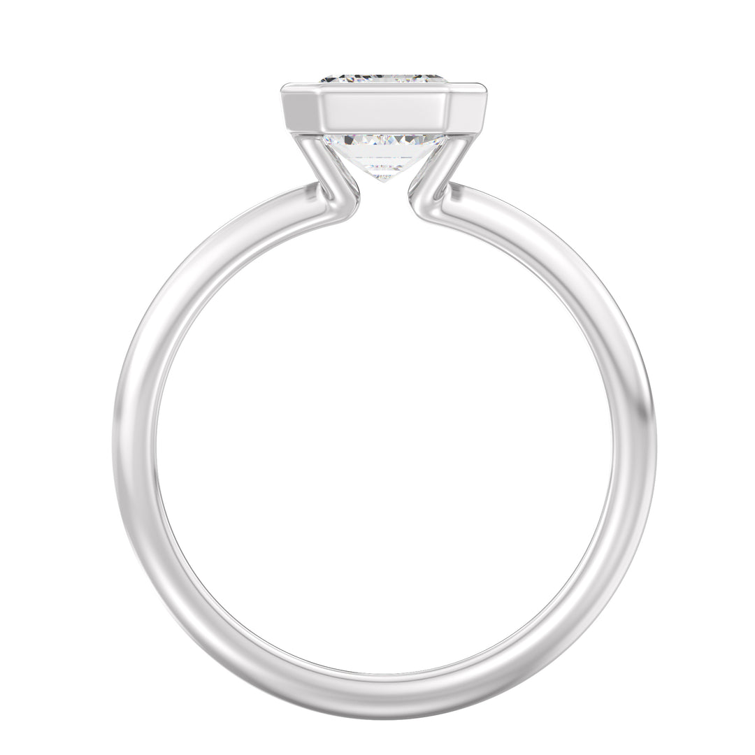 Emerald Cut Lab-Grown Diamond Bezel-Set Solitaire Ring in 18K White Gold. A brilliant emerald cut diamond is elegantly set in a modern bezel setting, complemented by the contemporary allure of white gold