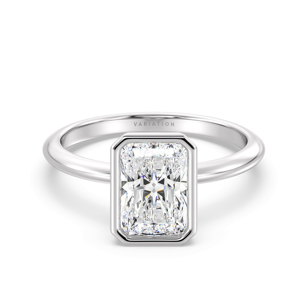 Radiant Cut Lab-Grown Diamond Solitaire Ring in 18K White Gold. Features a stunning radiant cut diamond set in a sleek bezel setting, highlighting timeless sophistication with a cool, silvery finish