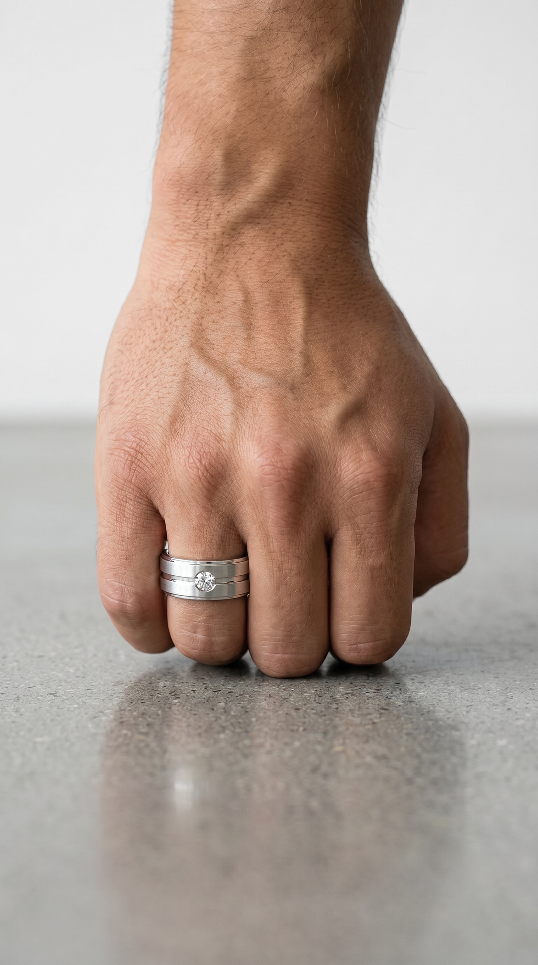 Architectural Platinum Band Ring Featuring a 0.15 Ct Round Brilliant Diamond