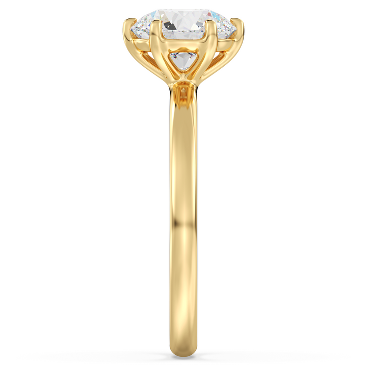 Timeless round brilliant cut lab grown diamond solitaire ring in 18K yellow gold with extraordinary sparkle and elegant design.