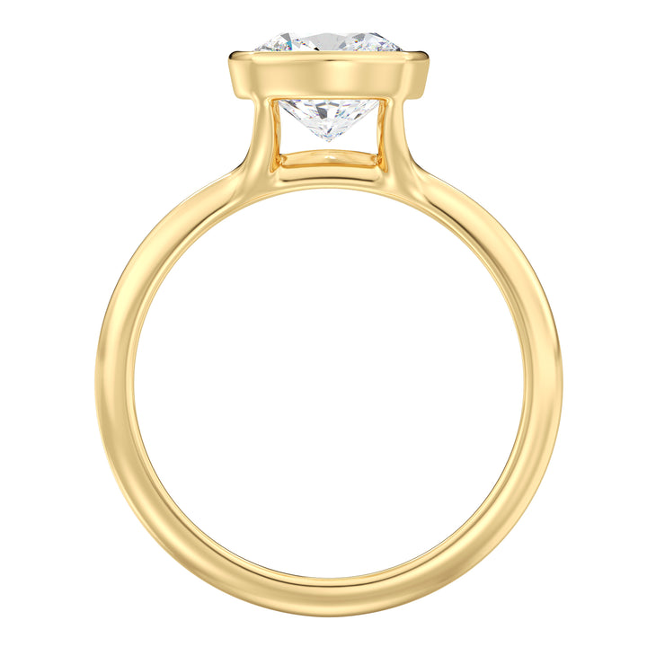 Cushion cut lab grown diamond ring in 18K yellow gold showcasing soft rounded corners, exceptional brilliance, and a secure bezel setting.