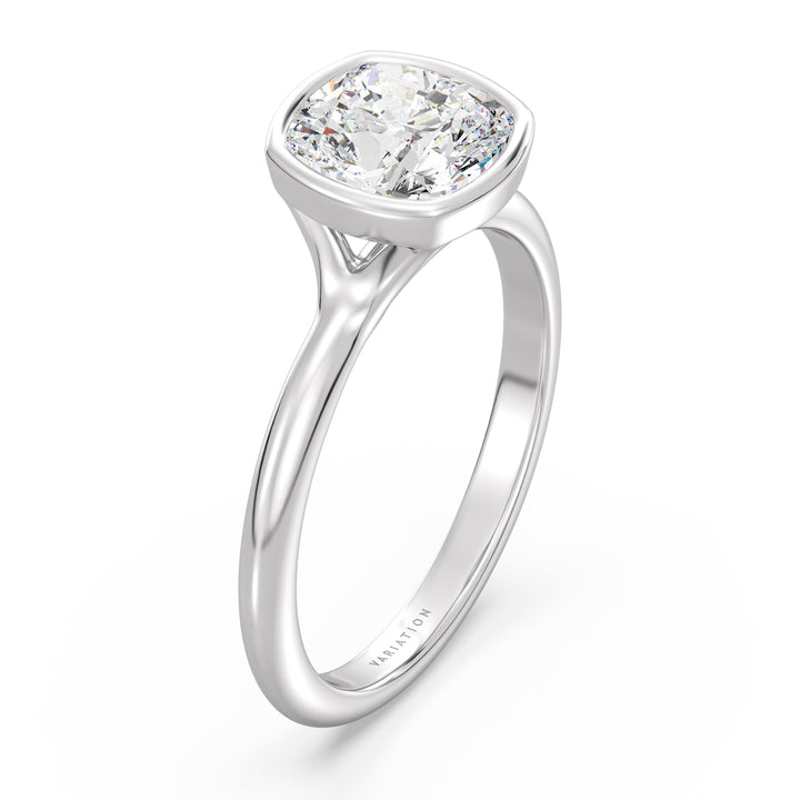 Cushion cut lab grown diamond bezel solitaire ring in 18K white gold with an IGI certified diamond and sleek modern bezel design.
