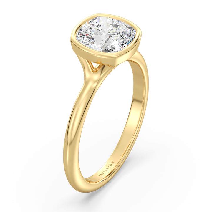 Cushion cut lab grown diamond bezel solitaire ring in 18K yellow gold featuring an IGI certified diamond with a modern bezel setting.