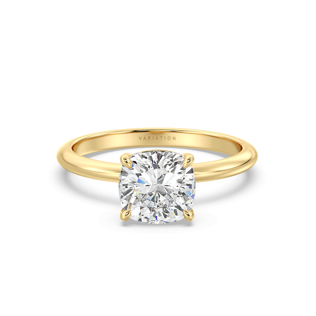 Cushion cut lab grown diamond solitaire ring in 18K yellow gold featuring an IGI certified diamond in a classic 4-claw prong setting.