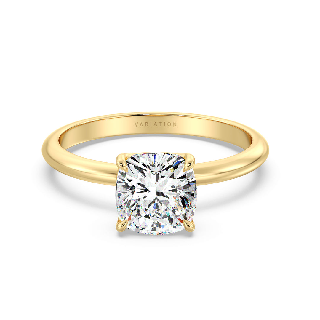 Cushion cut lab grown diamond solitaire ring in 18K yellow gold featuring an IGI certified diamond in a 4-claw prong open basket setting.