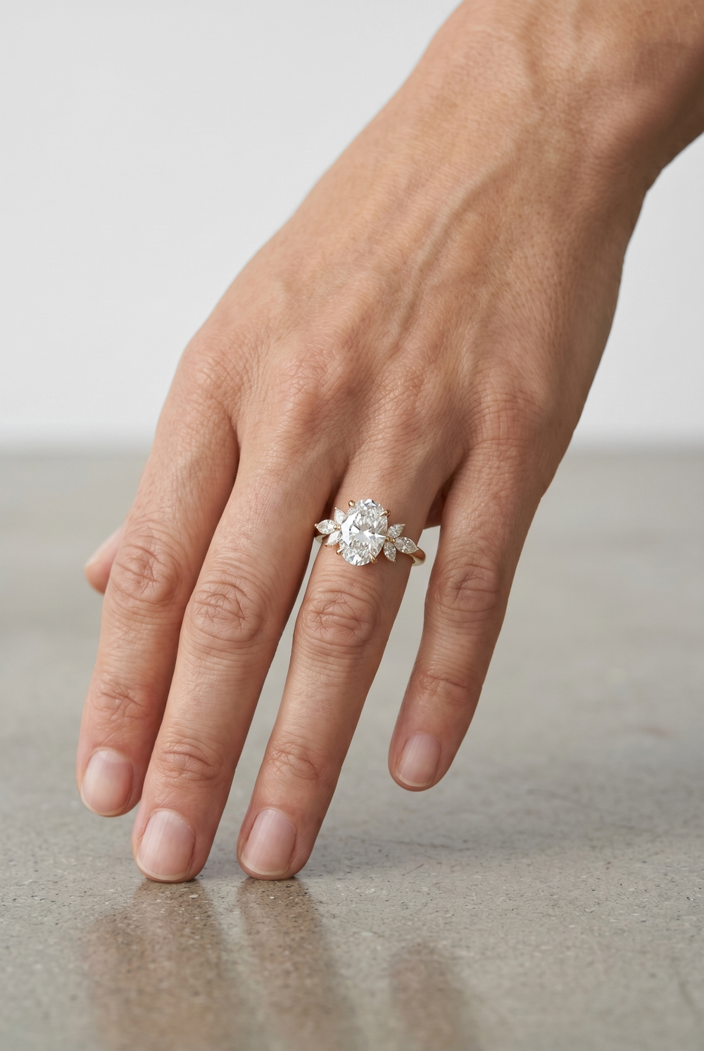 Elegant 2 Carat Oval Lab Grown Diamond Ring with Marquise Cut Accent Diamonds in 18K Yellow Gold