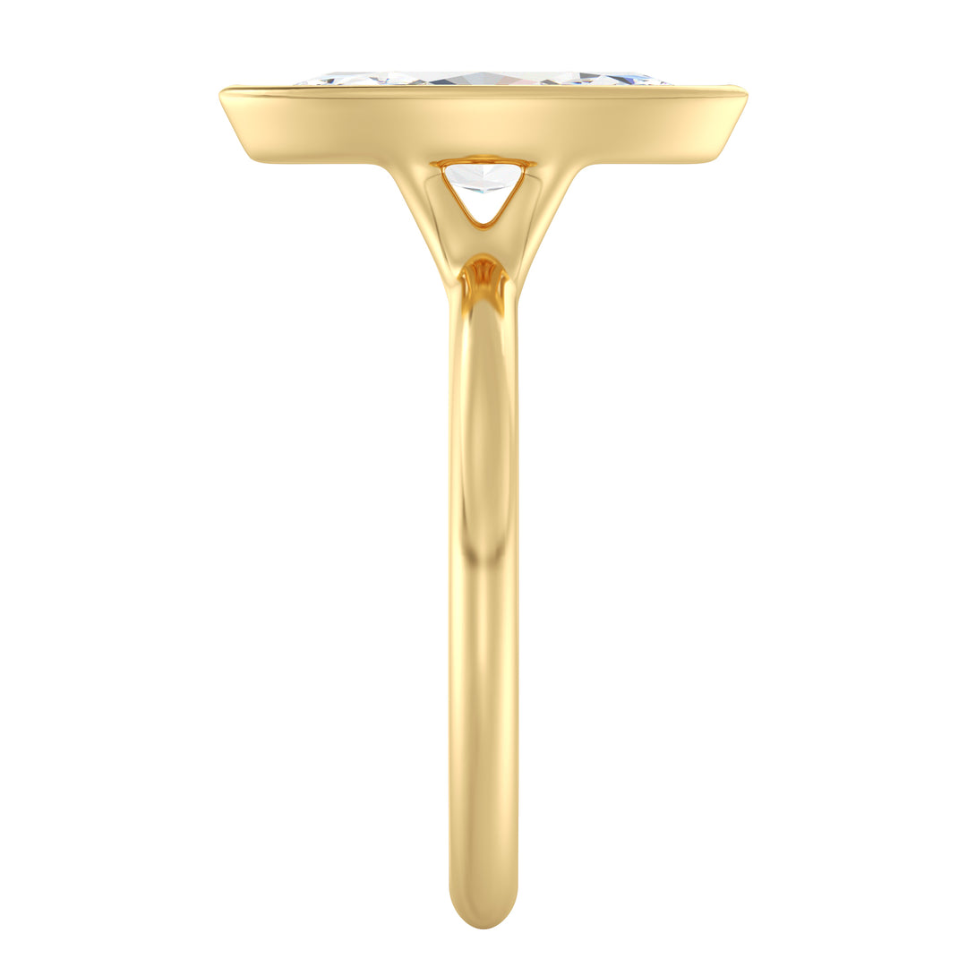 Marquise cut lab grown diamond ring in 18K yellow gold showcasing an elongated silhouette and secure bezel setting.