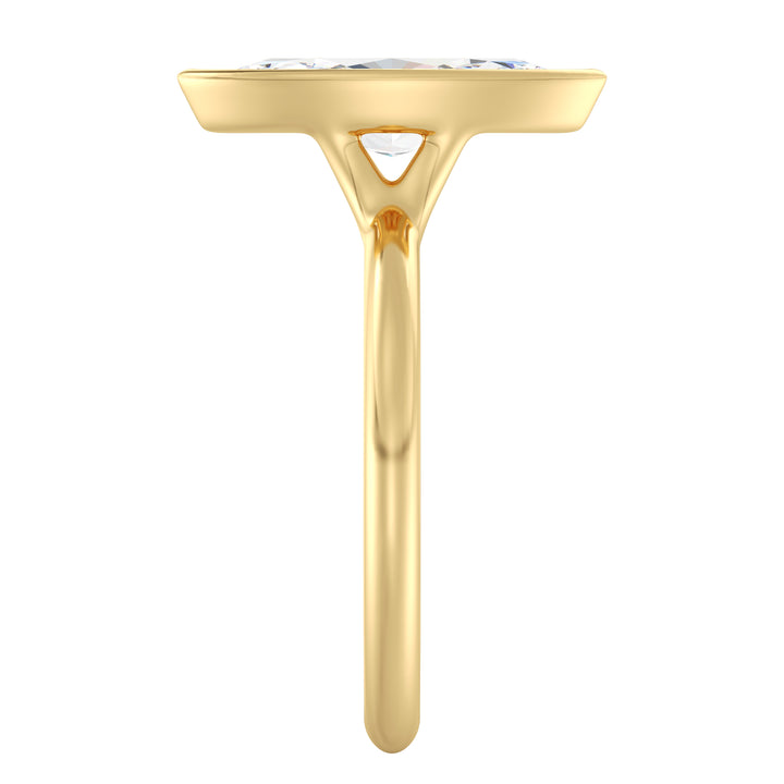 Marquise cut lab grown diamond ring in 18K yellow gold showcasing an elongated silhouette and secure bezel setting.