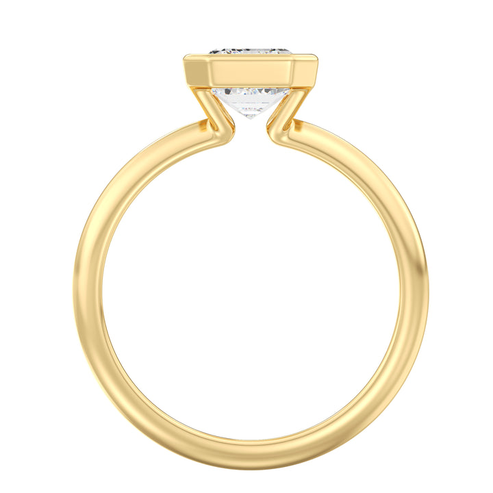 Top view of an emerald cut lab grown diamond bezel solitaire ring in 18K yellow gold showcasing exceptional clarity, step-cut facets, and modern elegance.