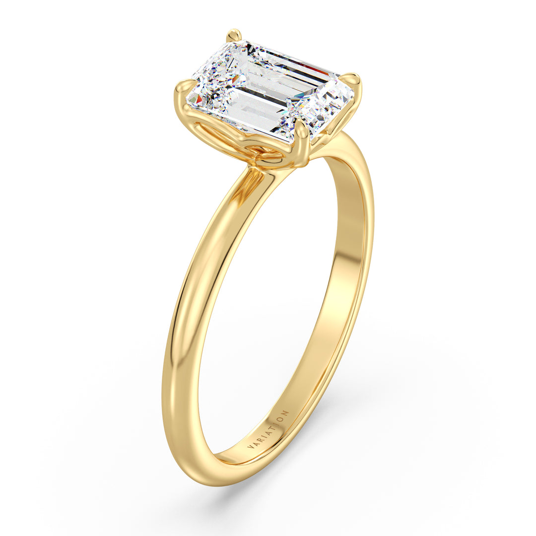 Emerald cut lab grown diamond solitaire ring in 18K yellow gold featuring an IGI certified diamond in a 4-claw prong open basket setting.