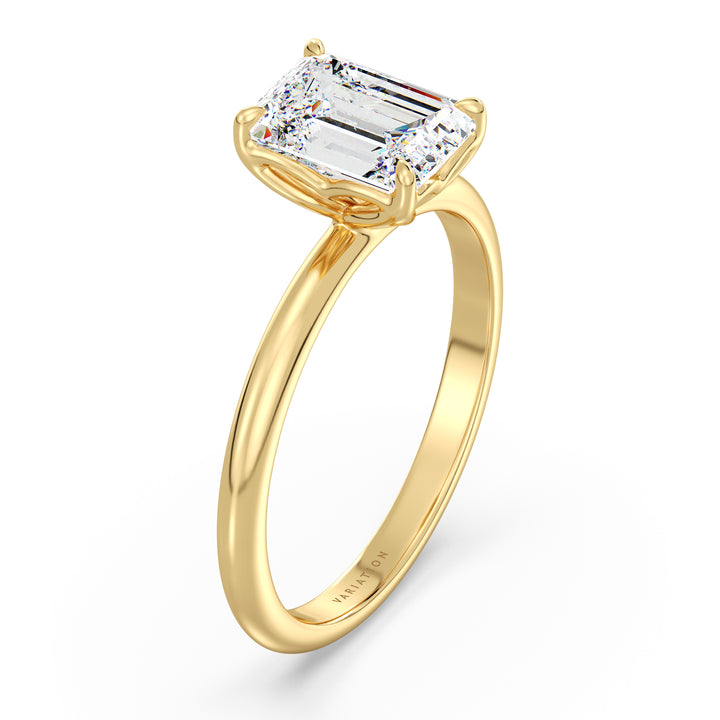 Emerald cut lab grown diamond solitaire ring in 18K yellow gold featuring an IGI certified diamond in a 4-claw prong open basket setting.