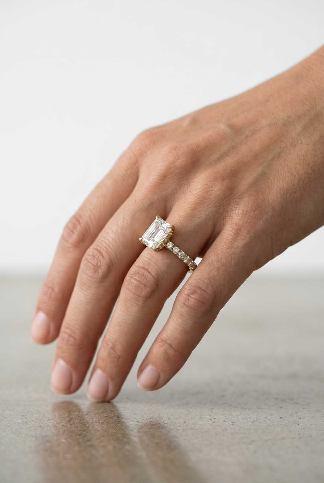 Emerald Cut Solitaire Lab Grown Diamond Ring with Hidden Halo Setting in 18K Yellow Gold