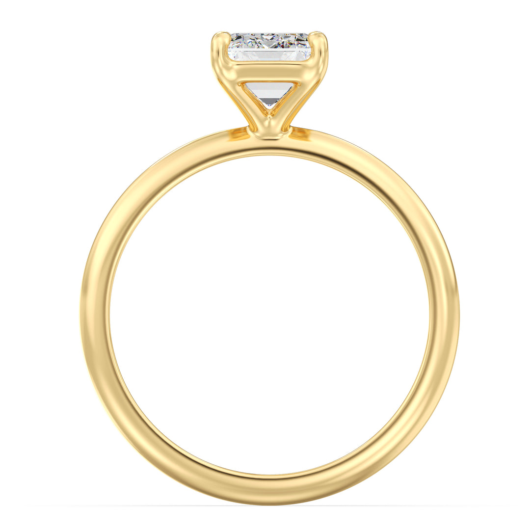 Emerald cut lab grown diamond ring in 18K yellow gold showcasing step-cut facets and the signature hall-of-mirrors effect.