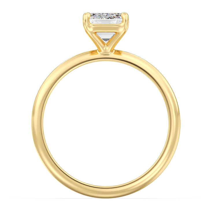 Emerald cut lab grown diamond ring in 18K yellow gold showcasing step-cut facets and the signature hall-of-mirrors effect.
