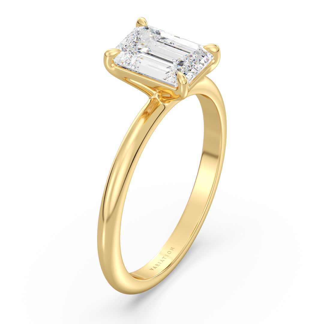 Elegant emerald cut lab grown diamond engagement ring crafted in 18K yellow gold with a timeless solitaire design.