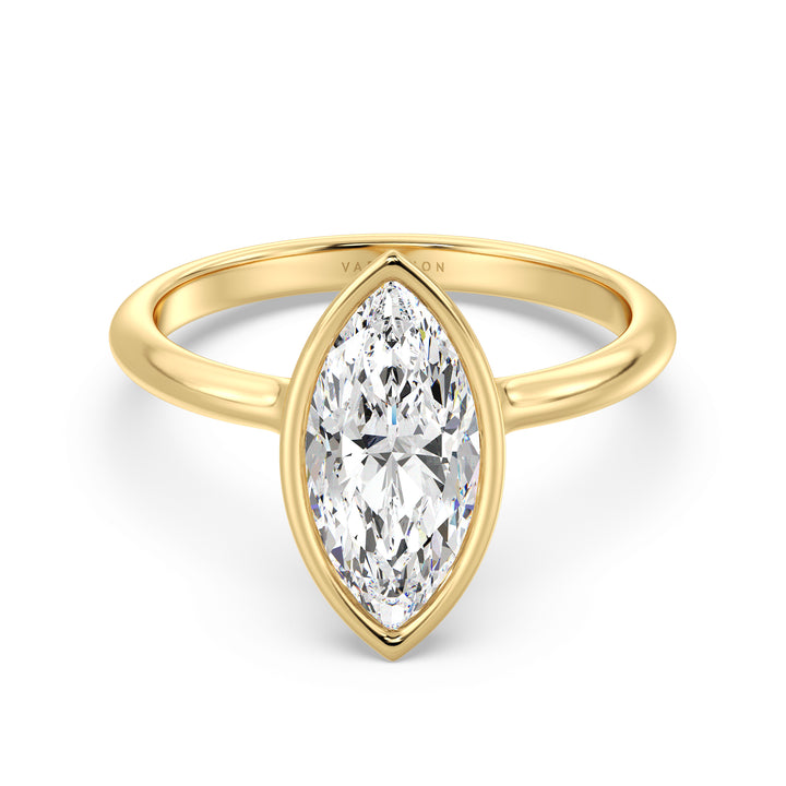 Elegant marquise cut lab grown diamond bezel engagement ring crafted in 18K yellow gold with a sleek contemporary design.