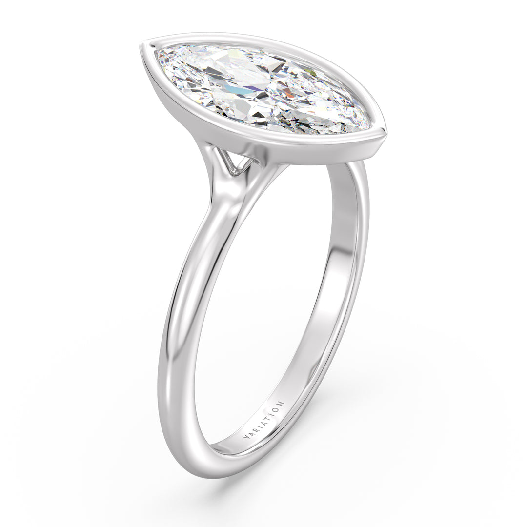 Marquise cut lab grown diamond bezel solitaire ring in 18K white gold with an IGI certified diamond and modern bezel design.