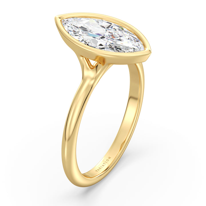 Marquise cut lab grown diamond bezel solitaire ring in 18K yellow gold featuring an IGI certified diamond with a modern bezel setting.