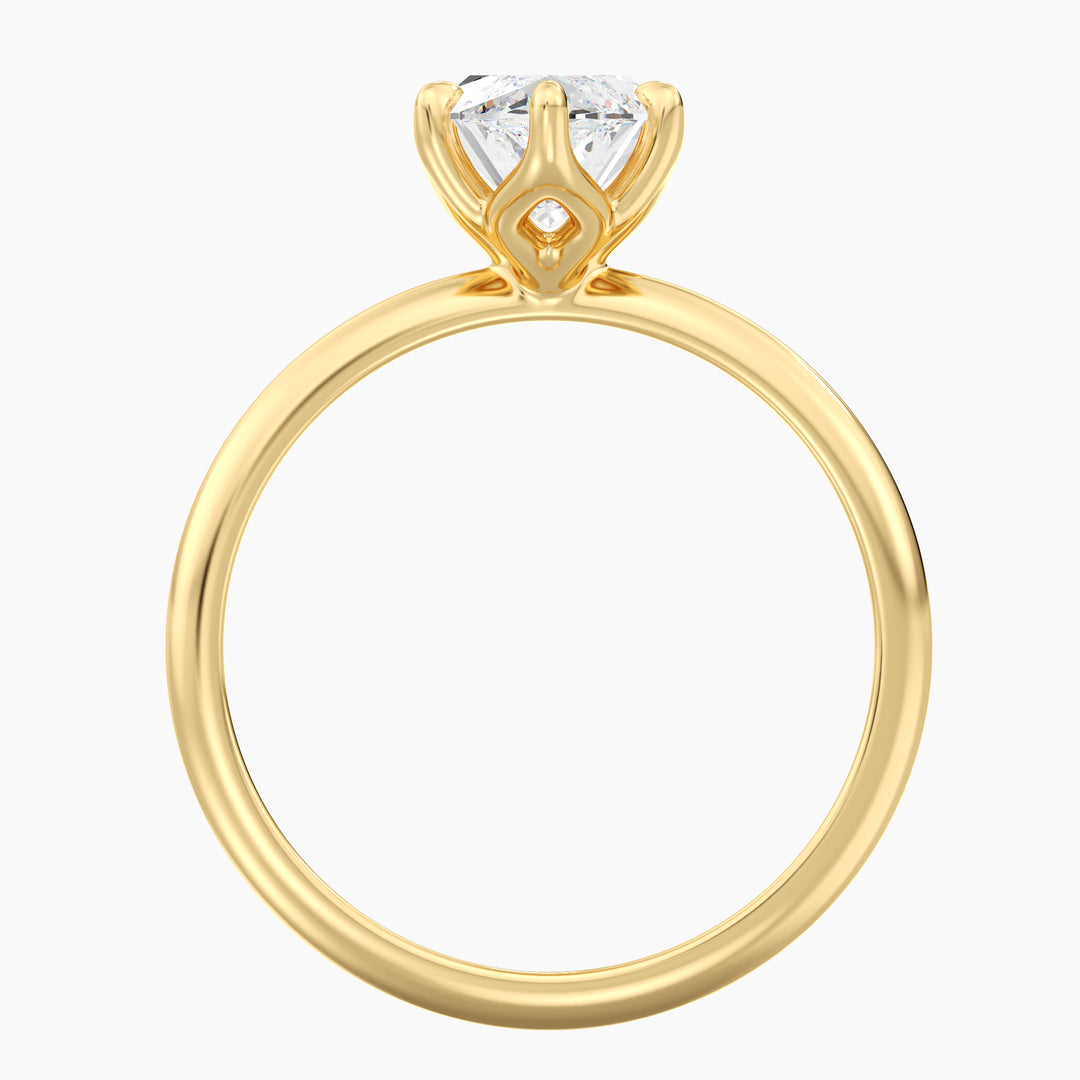 Marquise cut lab grown diamond ring in 18K yellow gold showcasing an elongated silhouette and open basket setting.