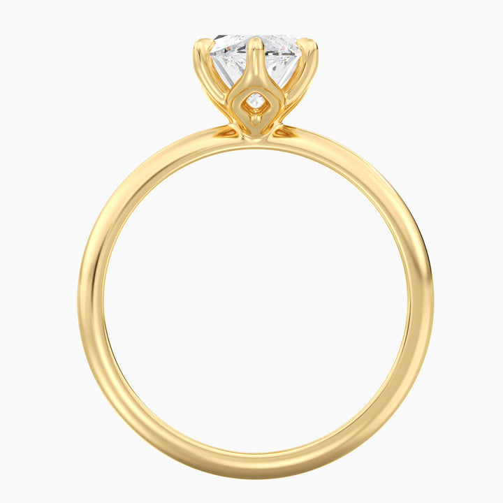 Marquise cut lab grown diamond ring in 18K yellow gold showcasing an elongated silhouette and open basket setting.