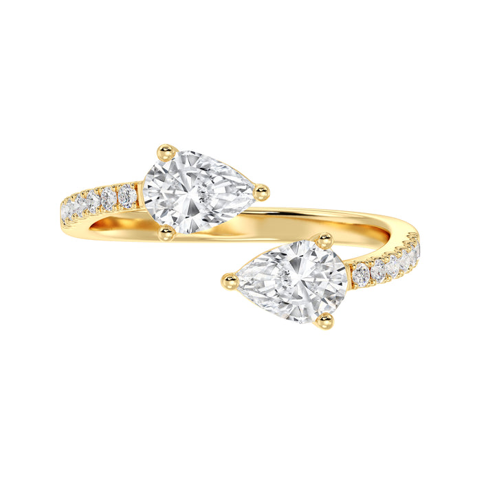 Contemporary pear cut lab grown diamond dual stone ring in 18K yellow gold symbolizing love, unity, and connection.