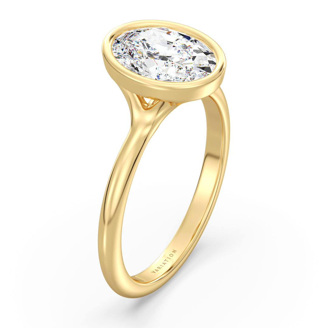 Oval cut lab grown diamond ring in 18K yellow gold showcasing exceptional brilliance, an elongated silhouette, and a secure bezel setting.