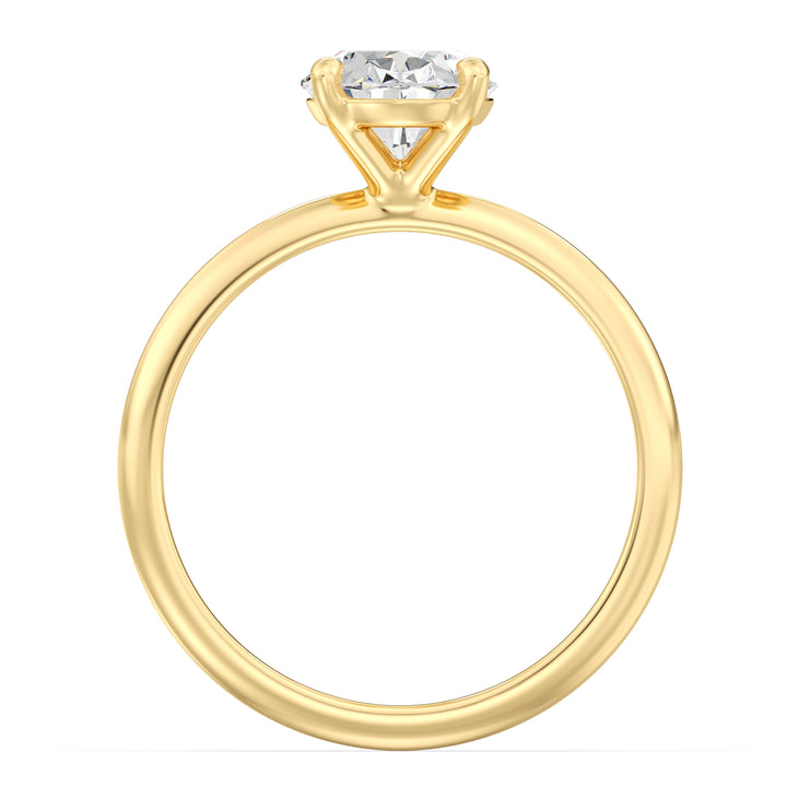 Oval cut lab grown diamond ring in 18K yellow gold showcasing exceptional brilliance, fire, and an elongated silhouette.