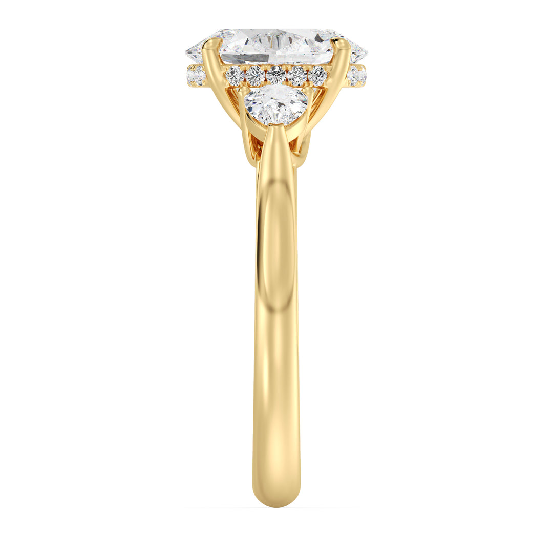 Oval Cut Engagement Ring with Pear Shaped Side Diamonds in Yellow Gold