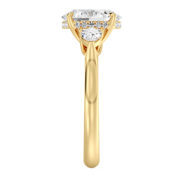 Oval Cut Engagement Ring with Pear Shaped Side Diamonds in Yellow Gold