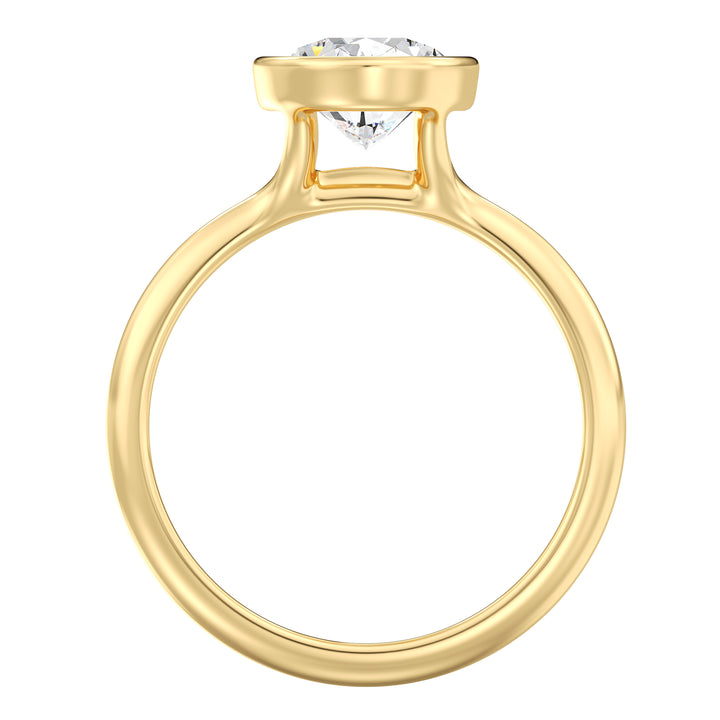 Side view of an oval cut lab grown diamond bezel solitaire ring in 18K yellow gold featuring an IGI certified diamond and sleek modern bezel setting.