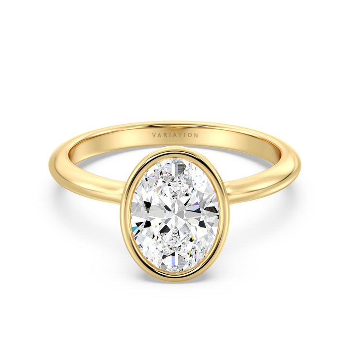 Oval cut lab grown diamond bezel solitaire ring in 18K yellow gold featuring an IGI certified diamond with a modern bezel setting.