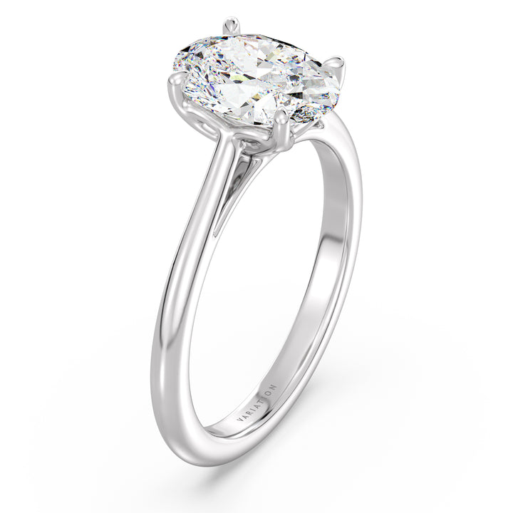 Oval cut lab grown diamond solitaire ring in 18K white gold with an IGI certified diamond and elegant 4-claw prong setting.