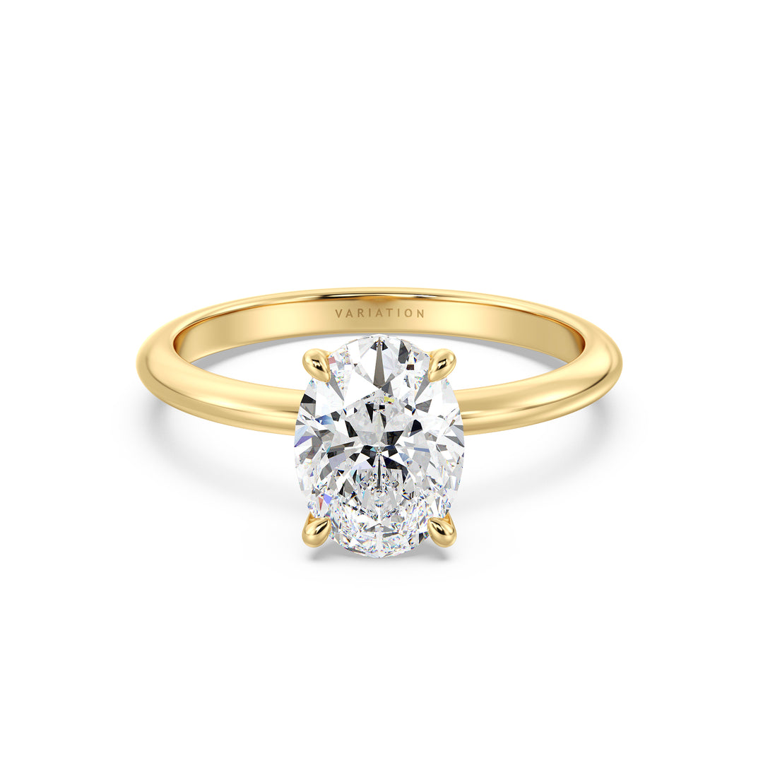 Oval cut lab grown diamond solitaire ring in 18K yellow gold featuring an IGI certified diamond in a classic 4-claw prong setting.
