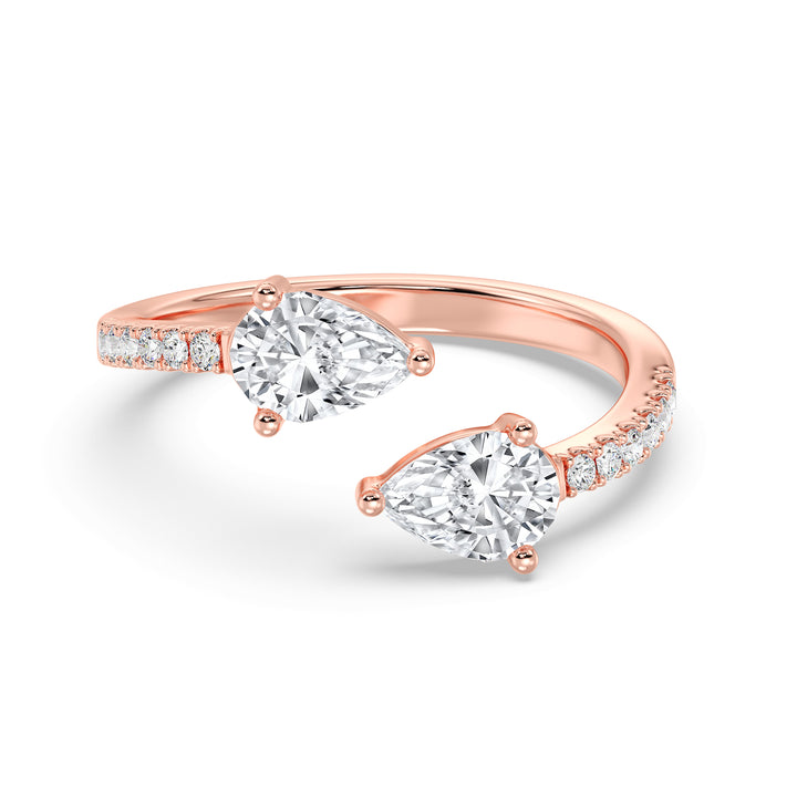 Pear cut lab grown diamond dual stone open cuff ring in 18K rose gold featuring two pear-shaped diamonds and brilliant accent stones.