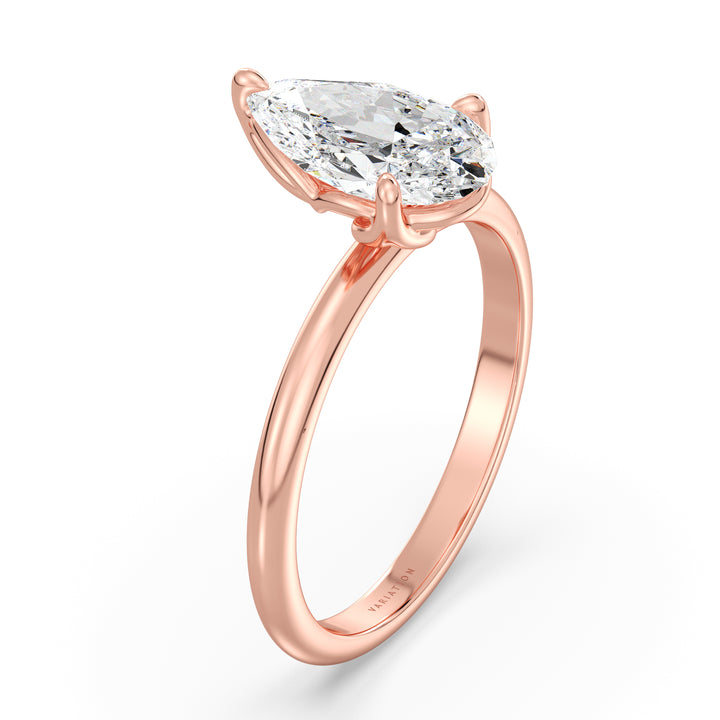 Pear cut lab grown diamond solitaire engagement ring in 18K rose gold featuring an IGI certified diamond with an elegant open basket setting.