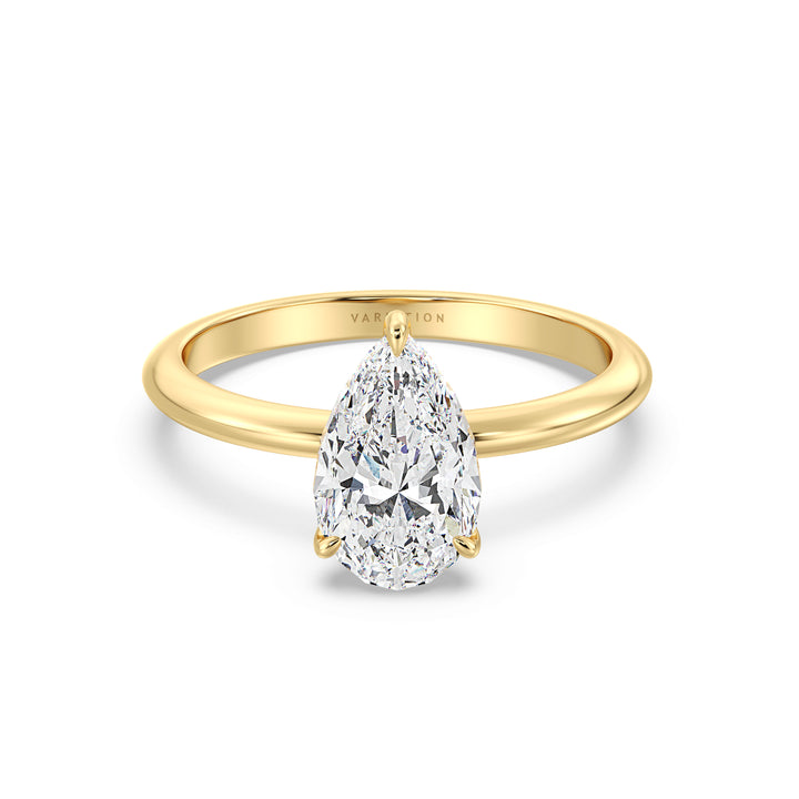 Pear cut lab grown diamond solitaire ring in 18K yellow gold featuring an IGI certified diamond in a classic 3-claw prong setting.