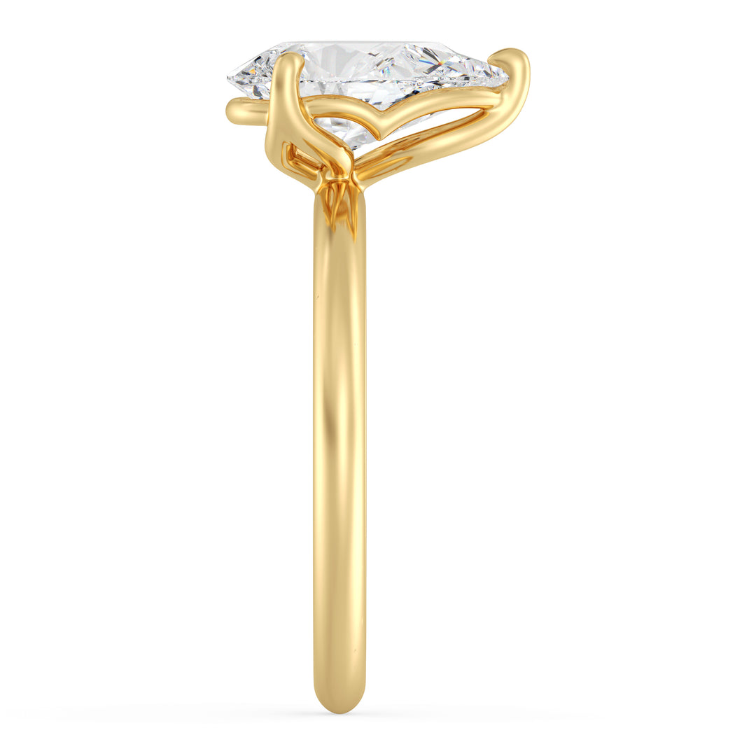 Pear cut lab grown diamond ring in 18K yellow gold showcasing a graceful teardrop silhouette and open basket setting.