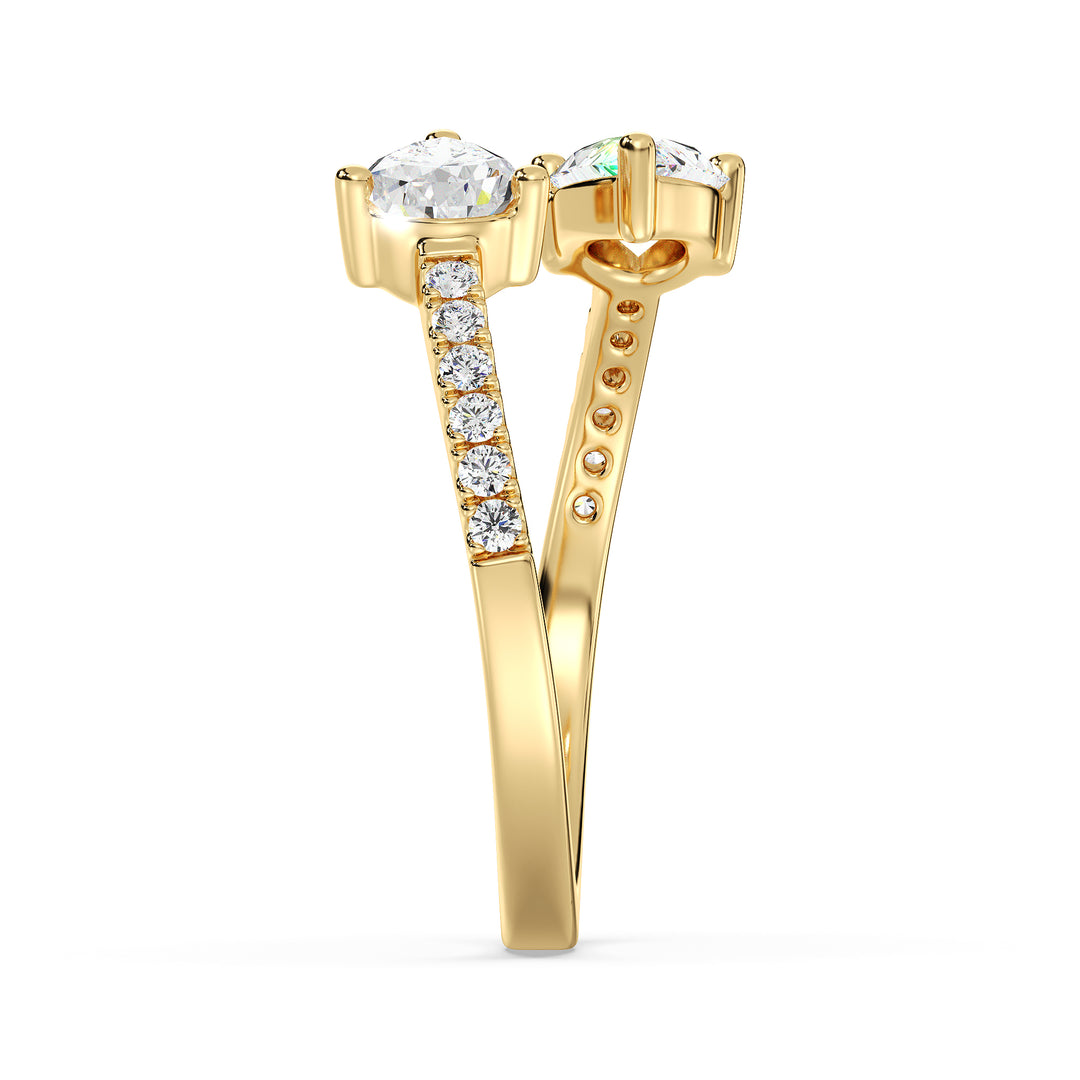 Pear cut lab grown diamond open cuff ring in 18K yellow gold showcasing two teardrop diamonds and a contemporary open design.