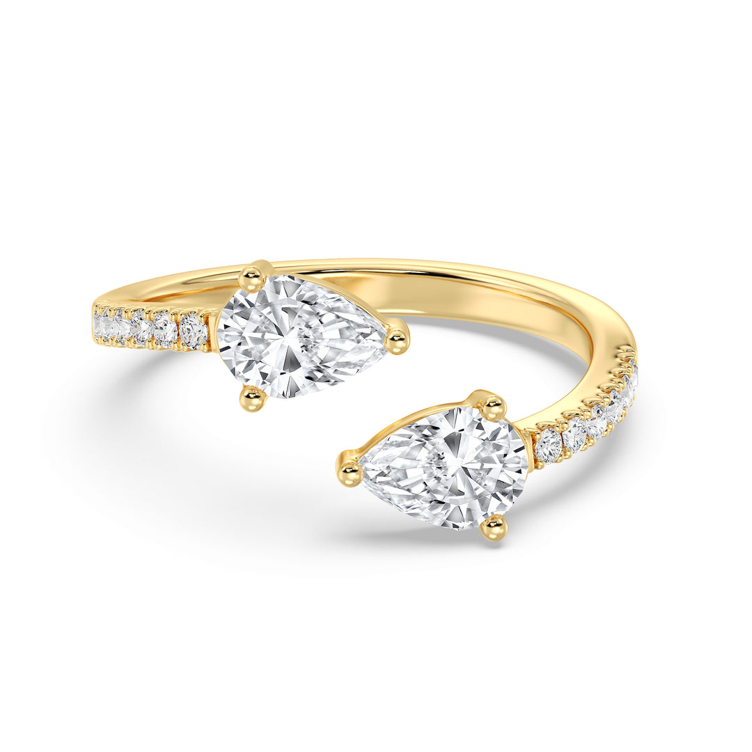 Elegant pear cut lab grown diamond open cuff ring in 18K yellow gold with dual teardrop diamonds and brilliant accent stones.