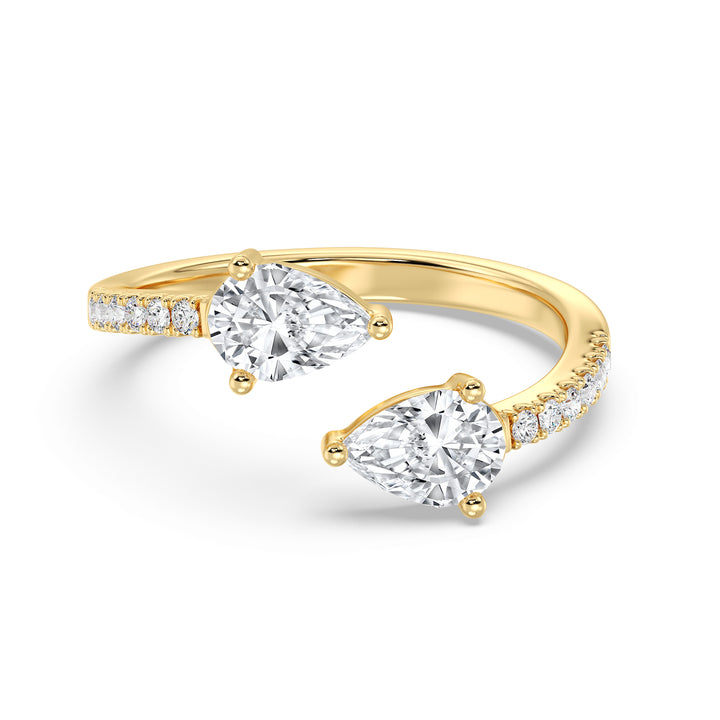 Elegant pear cut lab grown diamond open cuff ring in 18K yellow gold with dual teardrop diamonds and brilliant accent stones.