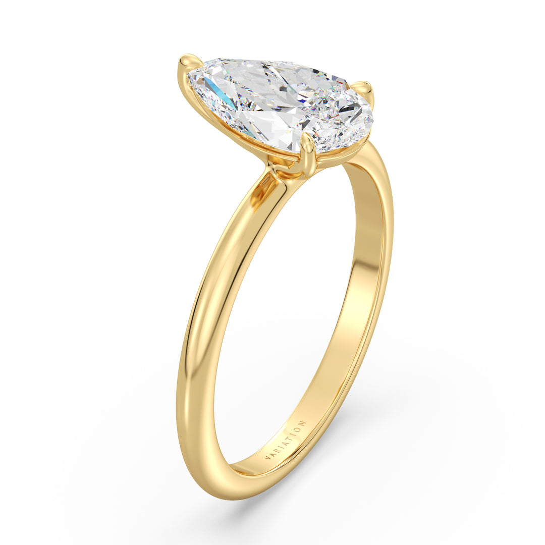 Elegant pear cut lab grown diamond engagement ring crafted in 18K yellow gold with a timeless solitaire design.