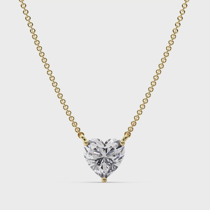 360° view of the 2.00 Carat Heart-Shaped Lab Grown Diamond Solitaire Pendant Necklace in 18K Yellow Gold, showcasing the prong setting and dazzling diamond center