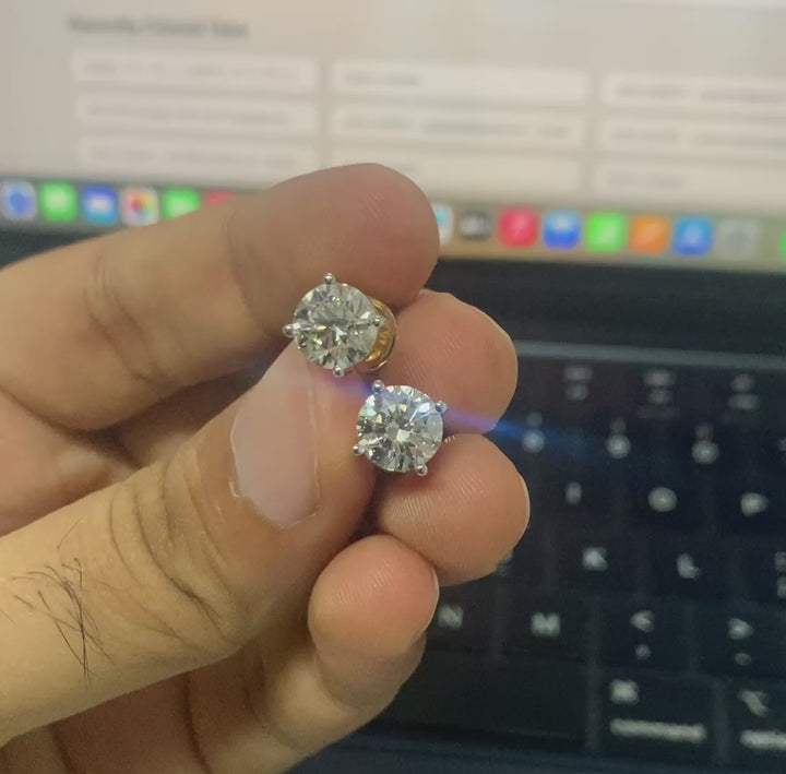 Real-life video of Lab Grown Diamond Stud Earrings capturing their sparkle and brilliance in natural light, showcasing the clarity, cut, and classic stud setting from various angles for a detailed view of the product.