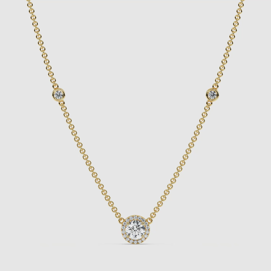 Video showcasing the Elegant Round Diamond Bezel Station Necklace in 18K Yellow Gold