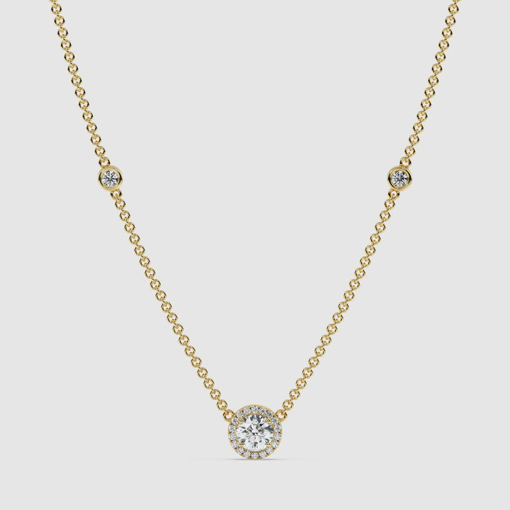 Video showcasing the Elegant Round Diamond Bezel Station Necklace in 18K Yellow Gold