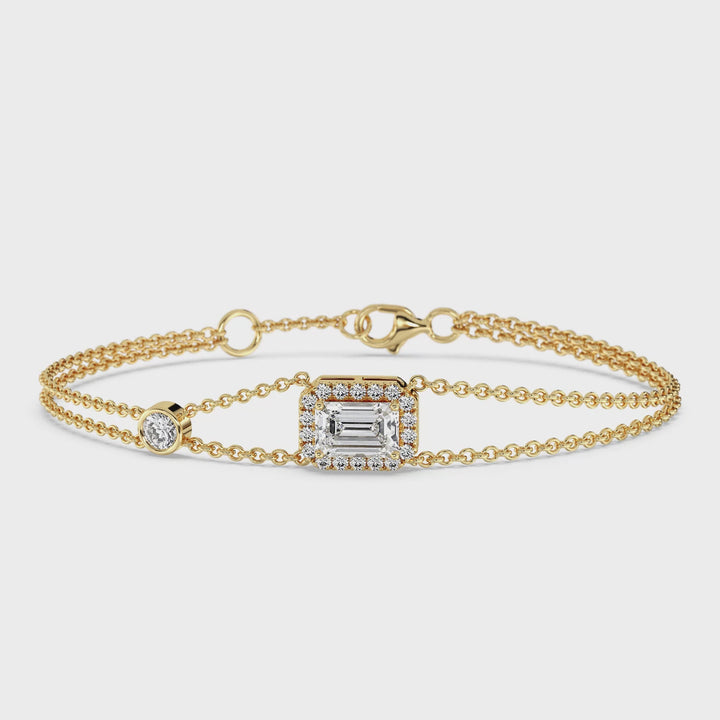 Video showcasing the Double Chain Bracelet in 18K Yellow Gold, featuring a 1ct emerald-cut lab-grown diamond in a dazzling halo setting with 19 round EF/VS lab diamonds, totaling 1.43ct