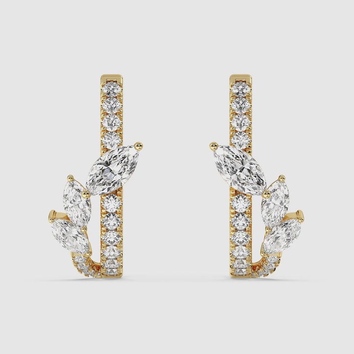 Video showcasing Elegant 18KT Yellow Gold Twist Hoop Earrings with Marquise-Cut and Round Lab-Grown Diamonds, featuring 34 sparkling diamonds totaling 1.148ct, highlighting the intricate twist design and brilliant craftsmanship from multiple angles