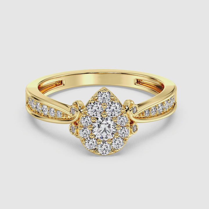 Video showcasing the 18K Yellow Gold Pear Shape Cluster Halo Engagement Ring with 0.70CTTW Round EF-VS Lab-Grown Diamonds, highlighting the ring's intricate design and sparkling diamonds from various angles.