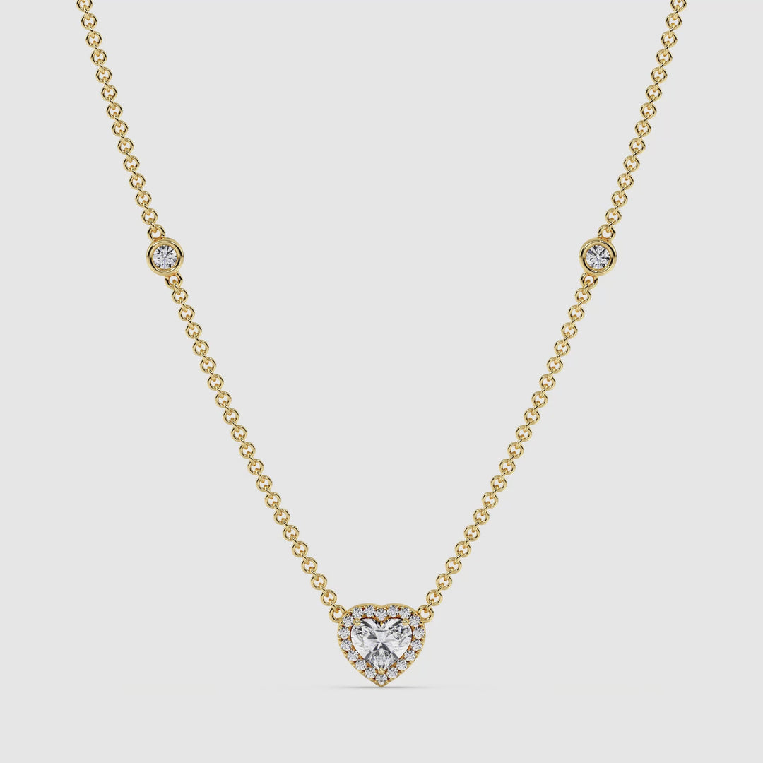 Video showcasing the Elegant Heart Diamond Bezel Station Necklace in 18K Yellow Gold