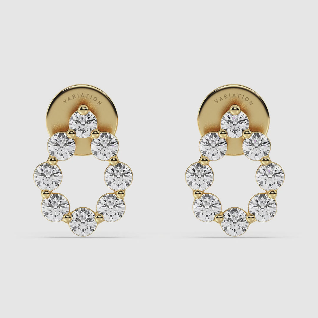 Video showcasing 18KT Yellow Gold Pear-Shaped Stud Earrings with Round Lab-Grown Diamonds. Features 16 sparkling round diamonds totaling 0.48 carats with EF color and VS clarity, set in a stylish pear shape for a luxurious and elegant look